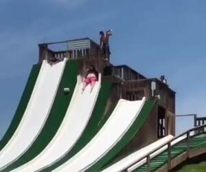 just a fat guy having some fun on a water slide