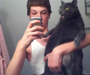 not how you hold a cat funny picture