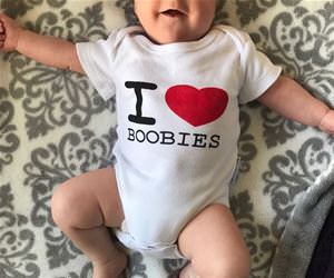 this baby loves boobies. funny picture