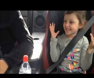 little girls reaction to some fast driving