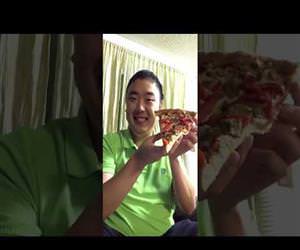 man eats an entire slice of pizza in one bite Funny Video