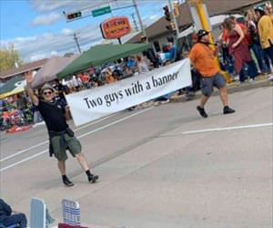 2 guys with a banner