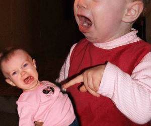 Baby angry at Doll