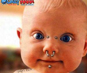 Little baby with face piercings.