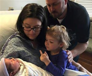 newborn sibling funny picture