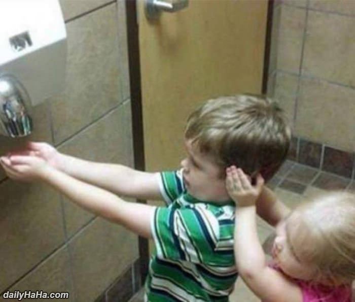 protecting her brothers ears funny picture