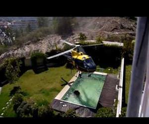 Amazing helicopter pilot taking water from swimming pool Funny Video
