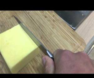 Making chainsaw noises while cutting cheese Funny Video