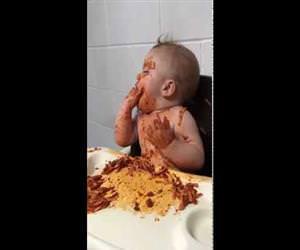 baby eating spaghetti while falling 